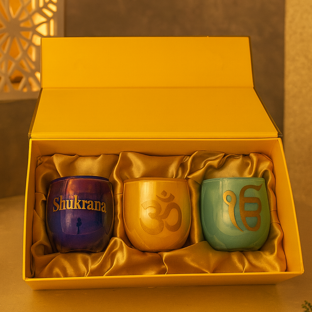 Three colorful mugs with symbols in a yellow box on a wooden surface.