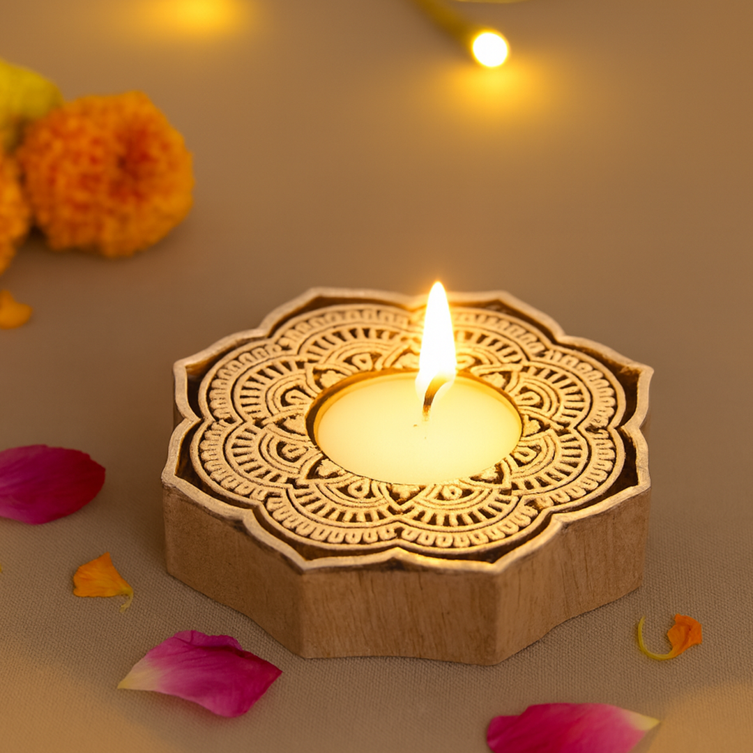 Decorative wooden candle holder with a lit candle on a soft surface with flowers and petals.